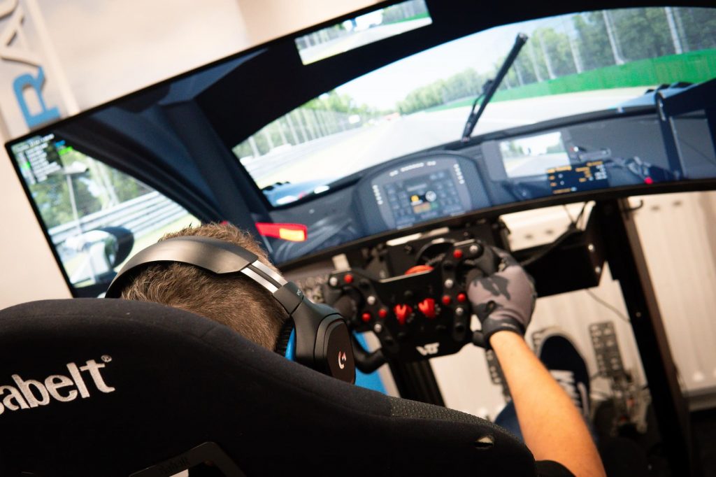 Racing simulator steering wheel and ultra wide monitor
