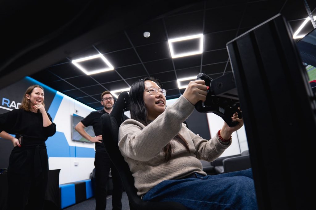 Someone trying the motion racing simulator for the first time